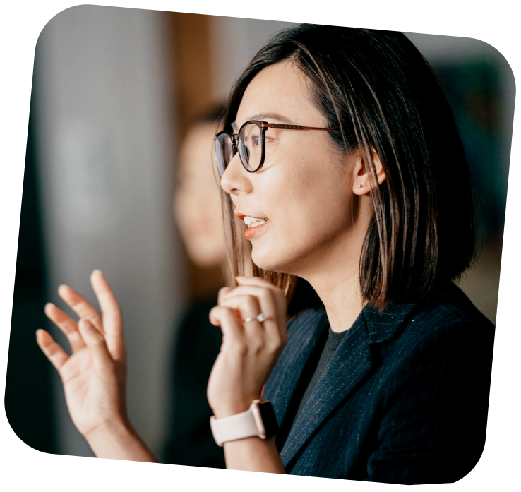 small-business-support-programs-4-teaching private AI workshops A teacher is talking with her hands up.
