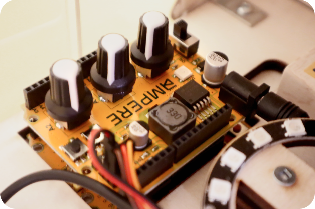 A close up of an Ampere branded micro:bit with all components connected to it.