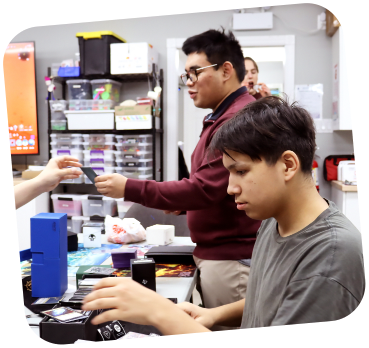 Two learners working within the makerspace. They are both focused on a task that is in front of them.