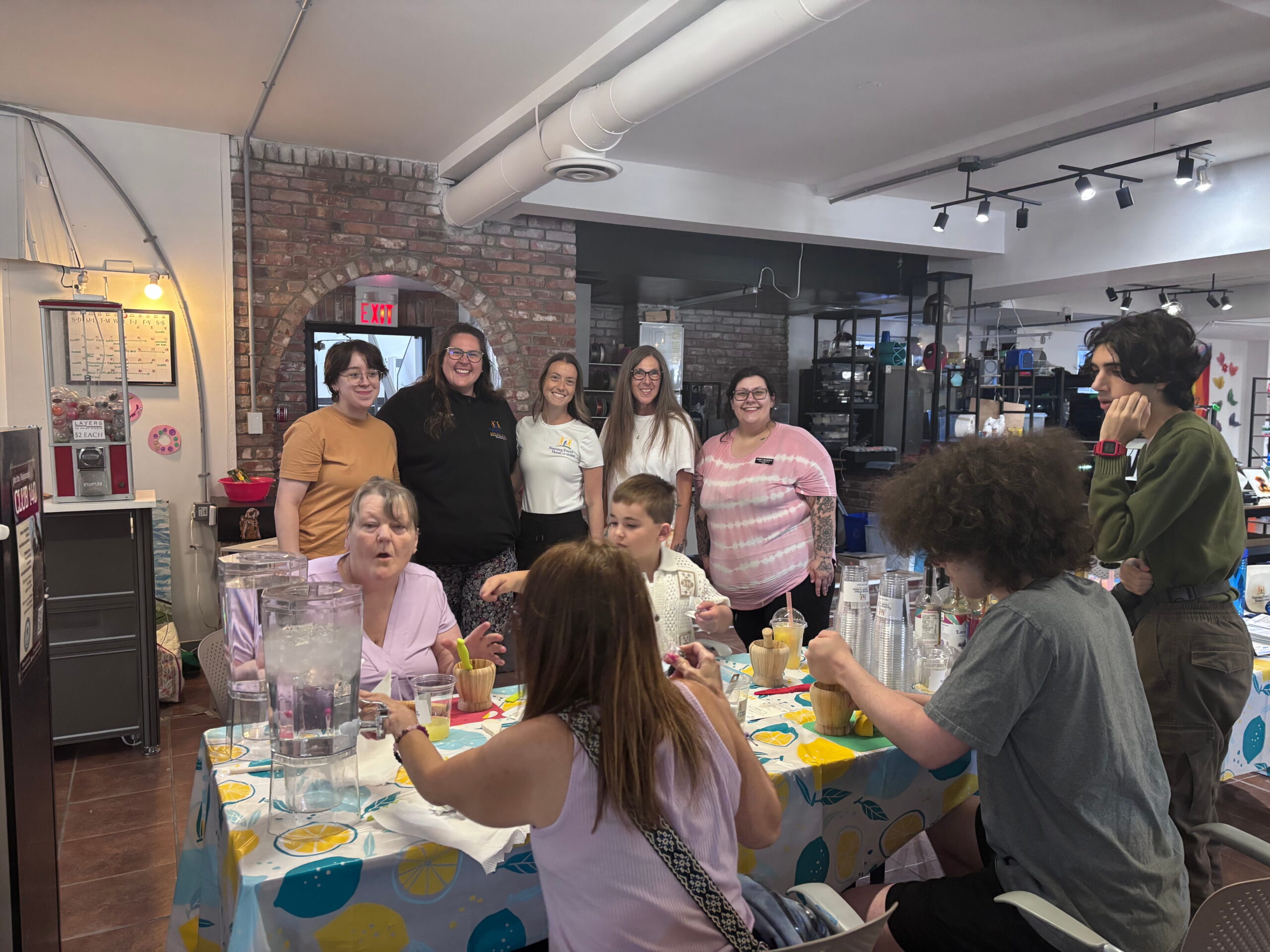 An Ampere Bathurst community partner leads a workshop in the Bathurst Makerspace & Skills Hub. Participants are seen standing and sitting watching the presentation.