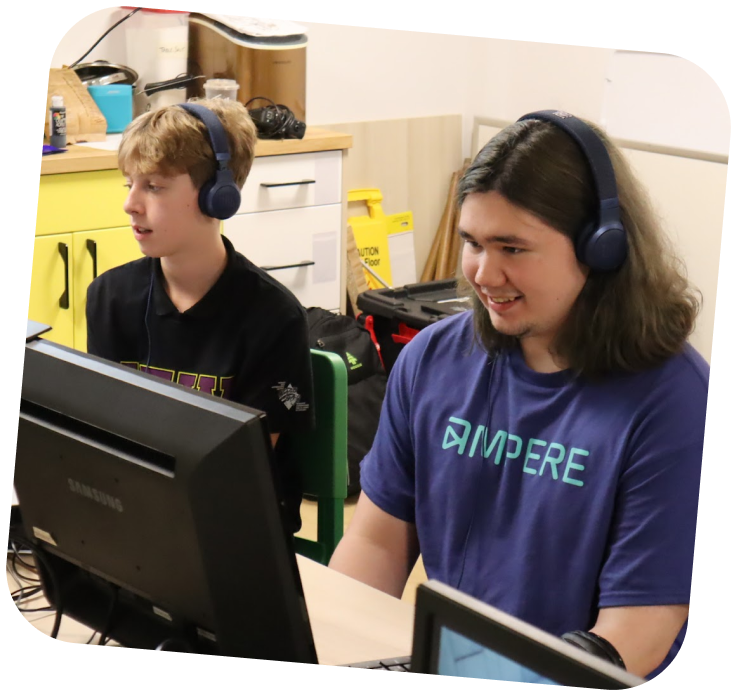 two-teens-learning-digital-skills-on-computers
