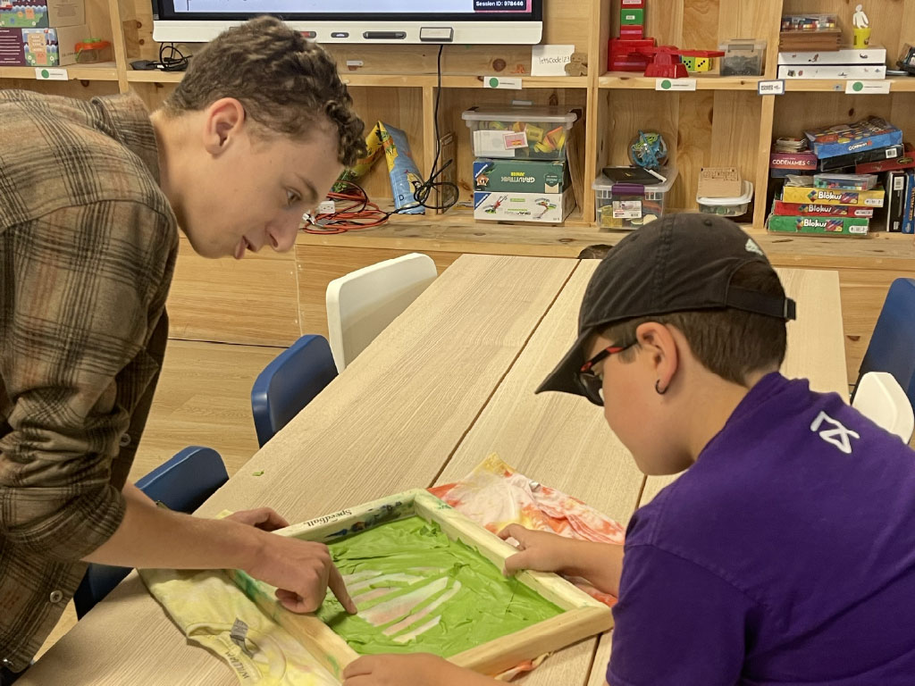 Jamie Jeffreys teaches a student at the Ampere Kawartha Lakes Makerspace & Skills Hub.